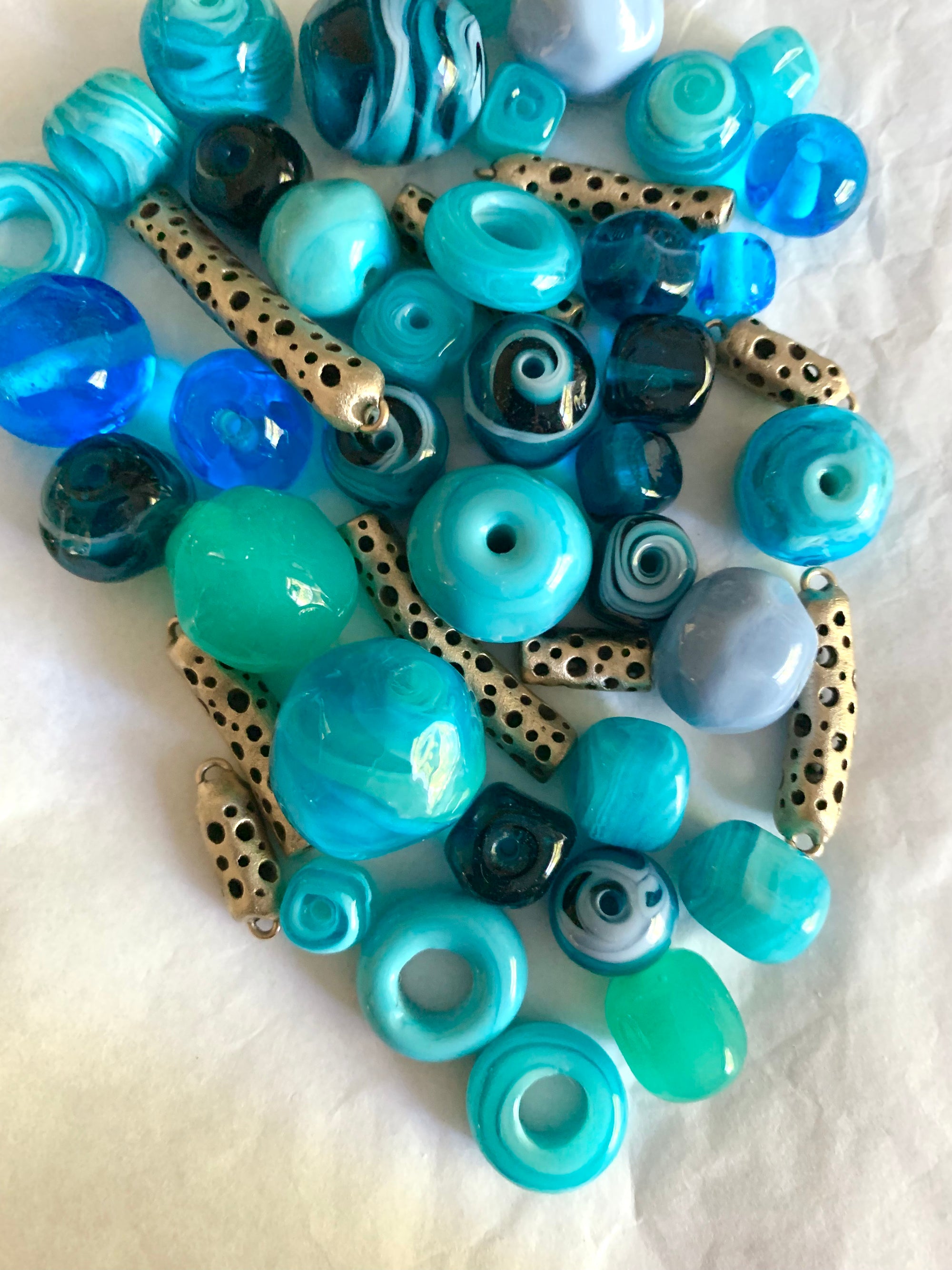 Tumbling bronze and ocean blue glass beads