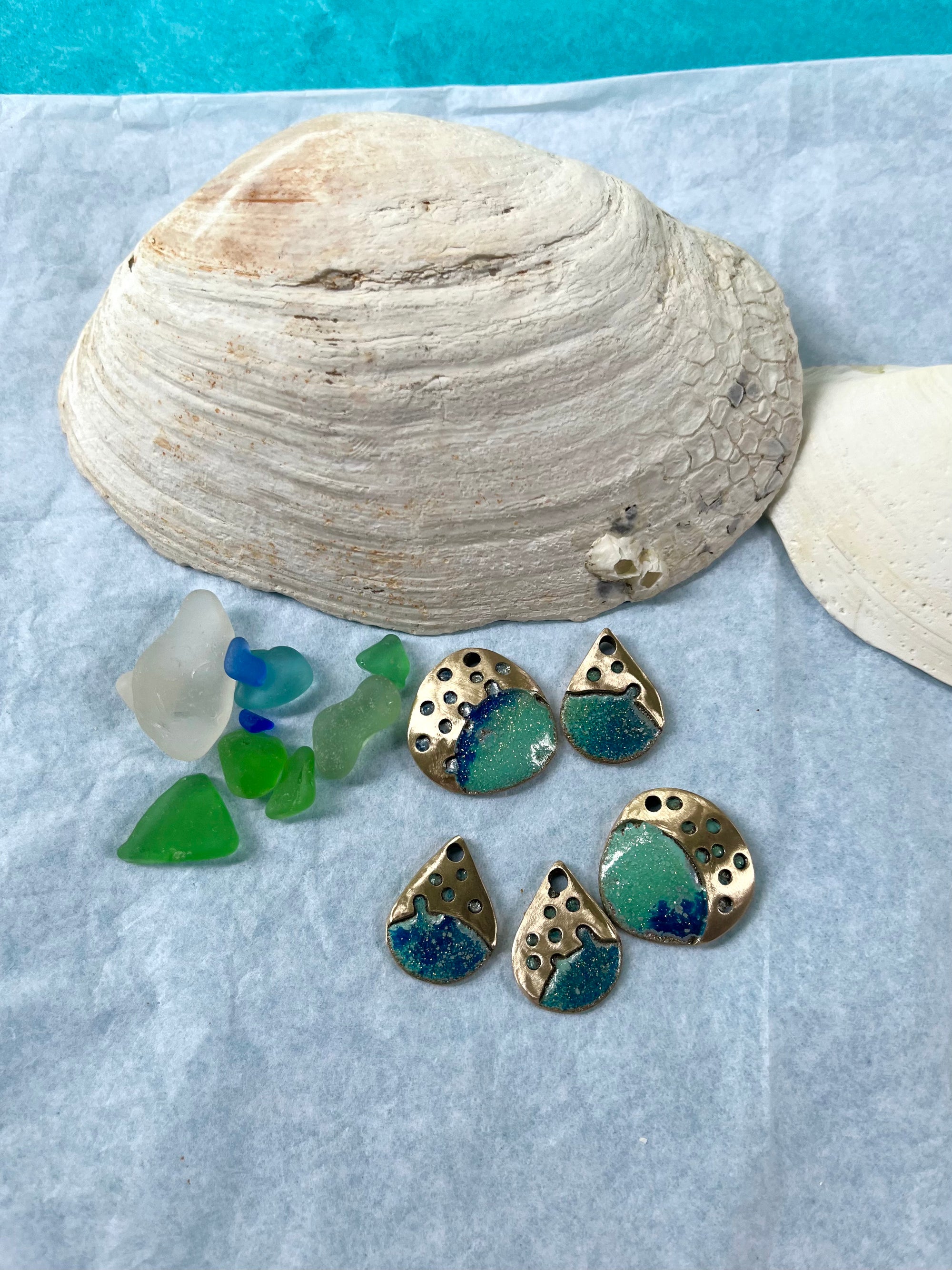 Ocean coloured bronze necklace pieces with seaglass and shells