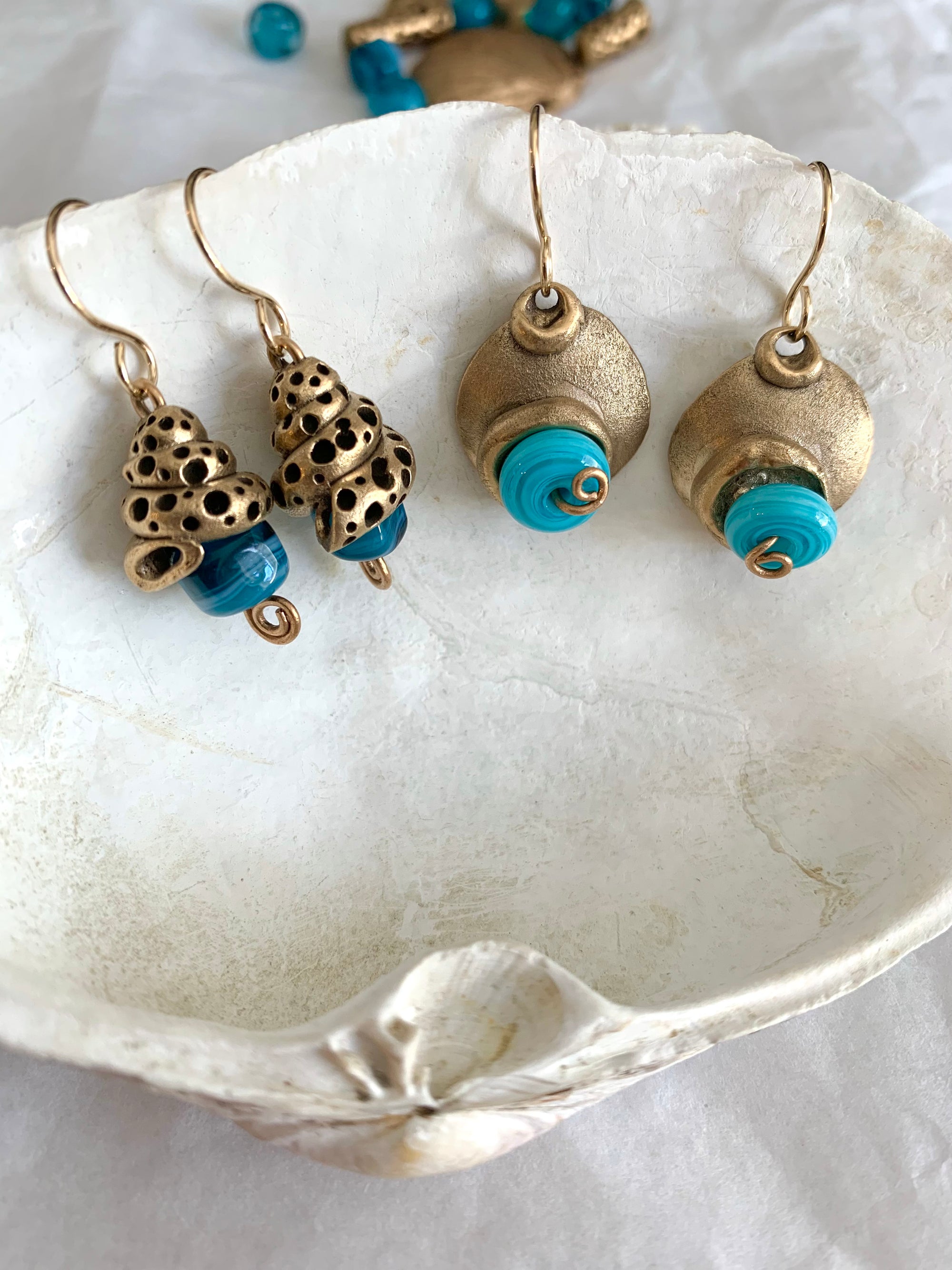 Earrings made from bronze and blue glass beads