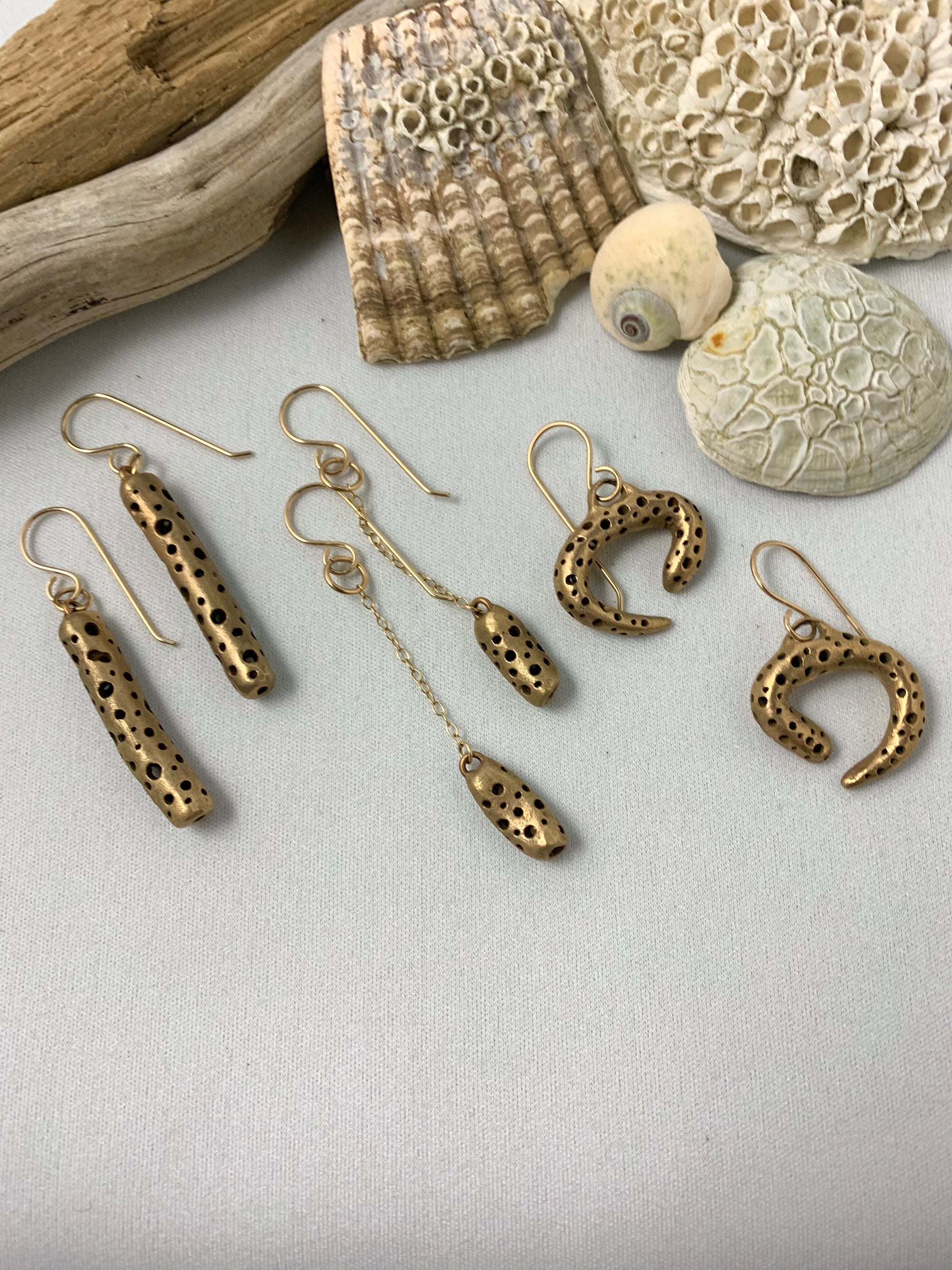 Three pairs of bronze handmade earrings with seashells