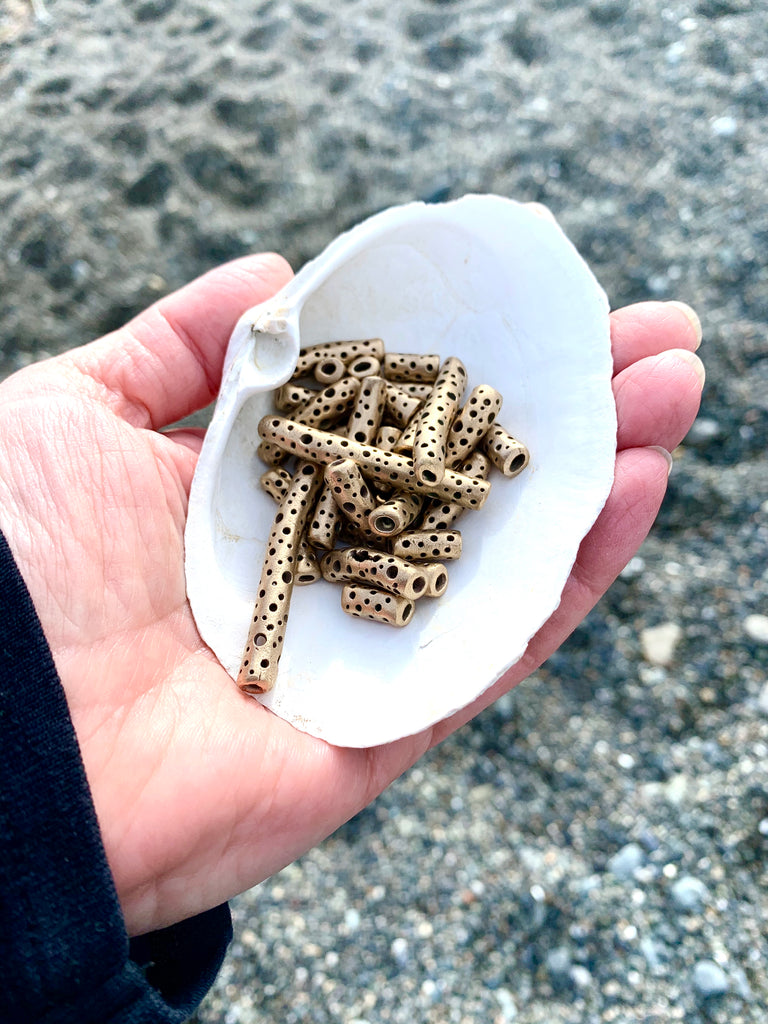 Bronze beads and beach combing