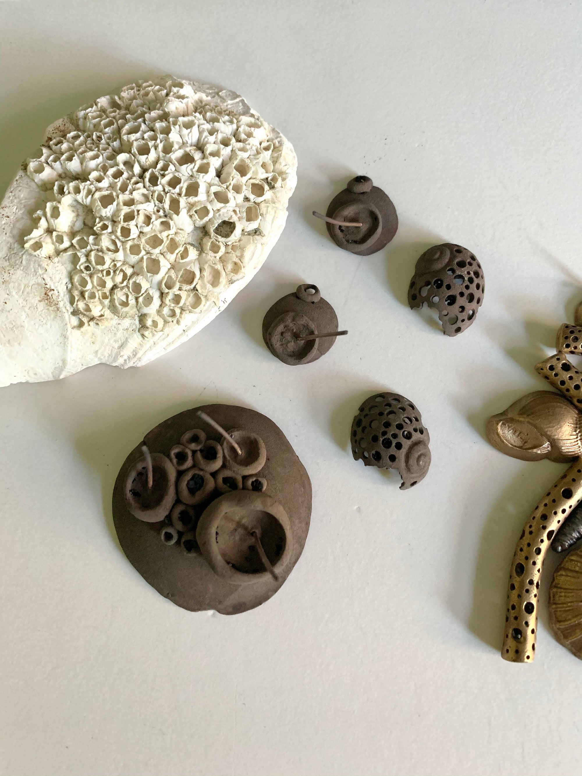 Barnacle seashell and new unpolished bronze jewelry work in process